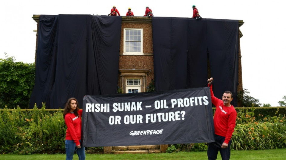 Environmental activists arrested after covering UK PM's home in black