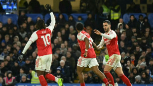 Merino strikes to give Arsenal bruising draw at 10-man Chelsea