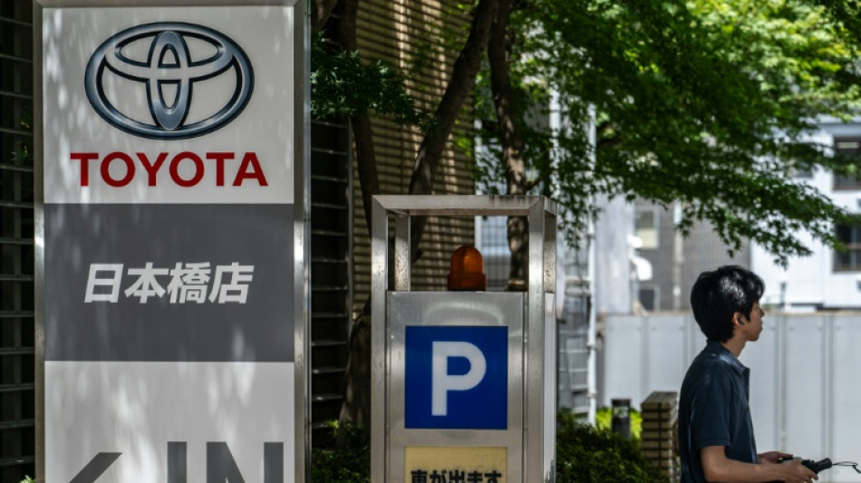 Weak yen helps auto giant Toyota raise forecasts