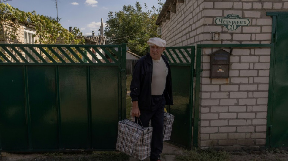 Ukrainians flee 'ghost town' as Russians seek recapture