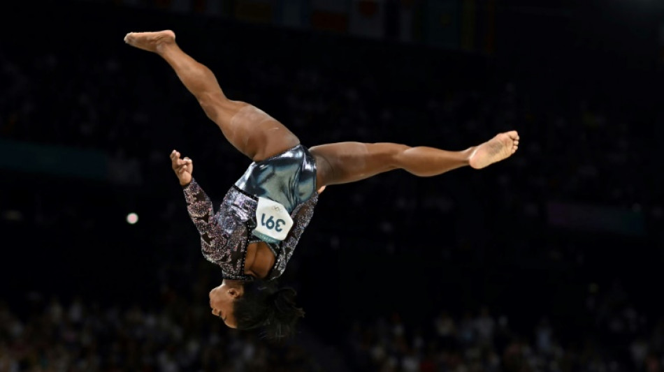 Biles dazzles on Olympic return, swimming awaits blockbuster duel
