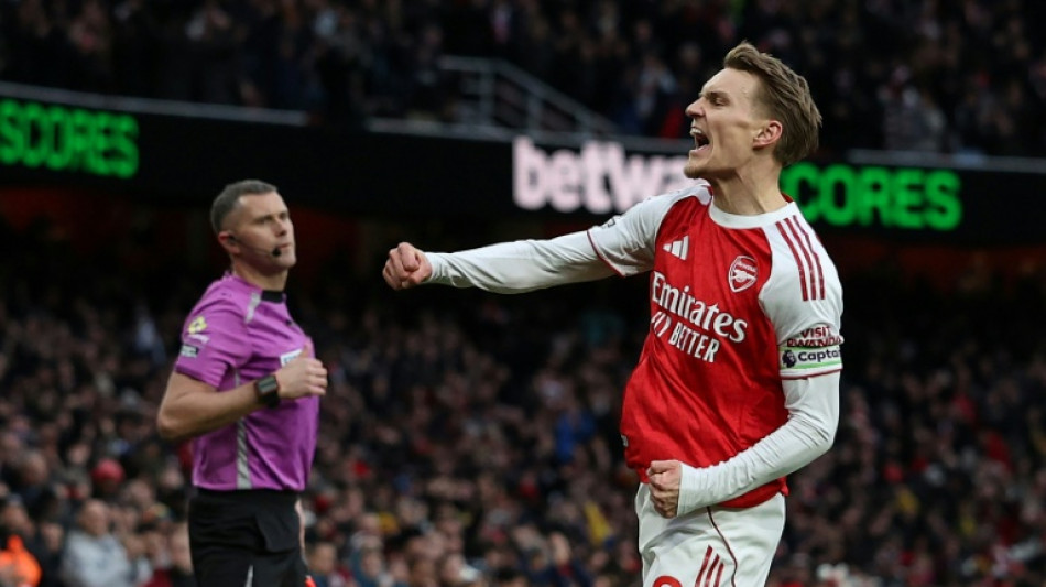 Arsenal ignore injury woes to retain top spot with win over Brighton