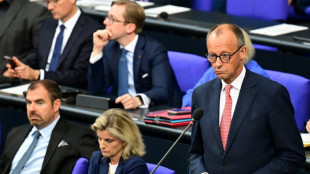 Merz zeigt Verständnis für Merkels Entscheidung zur Aufnahme vieler Geflüchteter